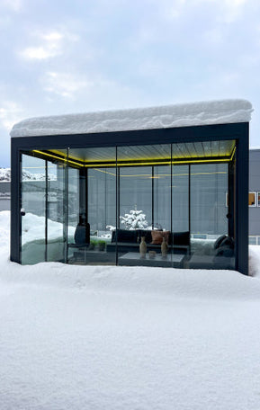 pergola with yellow lights under snow