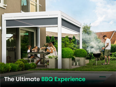 man with sunglasses grills next to family under white pergola sitting at dinner table. Text says " The Ultimate BBQ Experience"