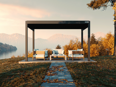 PERGOLUX pergola with furniture in a scenic fall landscape with mountains and trees.