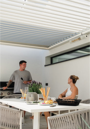 grilling under white pergola