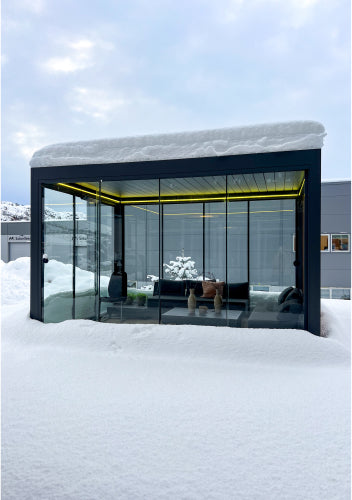 pergola with yellow lights under snow