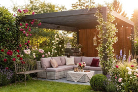 Outdoor garden setting with a pergola, sofa, and decorative flowers.