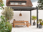 Outdoor patio with wooden dining set under a pergola, surrounded by plants.
