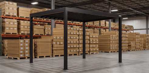 Large warehouse with stacked pallets of boxes behind a metal pergola.