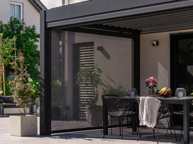 pergola screen with dining table and bowl of fruit