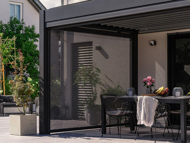 pergola screen with dining table and bowl of fruit